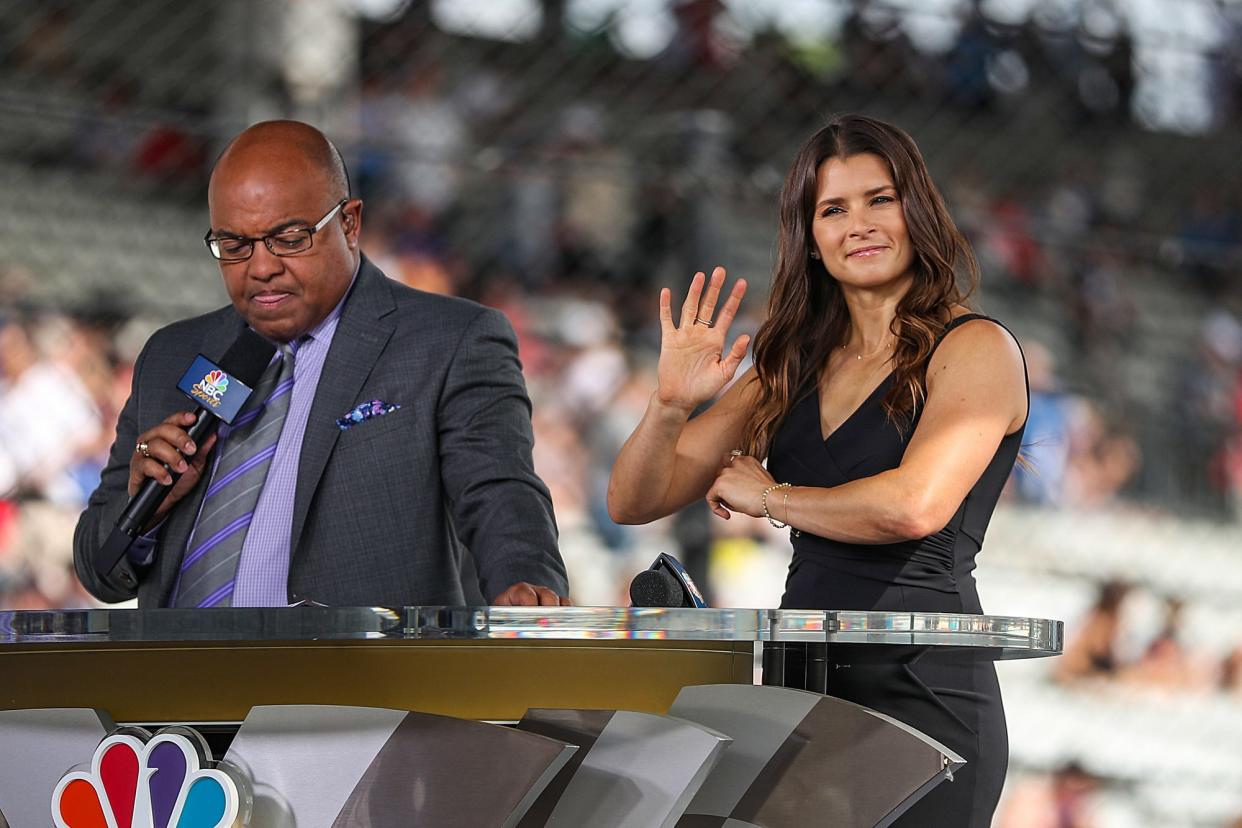 FILE -- From left, Mike Tirico and Danica Patrick prepare for an NBC Sports live telecast before the 103rd running of the Indy 500 at Indianapolis Motor Speedway, Sunday, May 26, 2019.