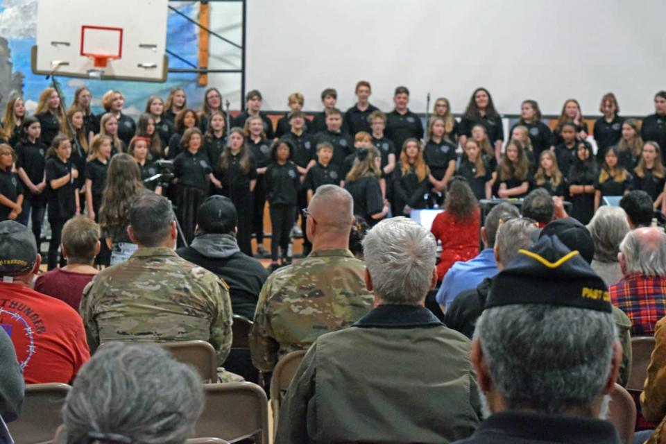 Veterans and their families watch a performance of the Rochester Middle School Chorus and Band on Thursday at the Middle School's Veterans Day ceremony.