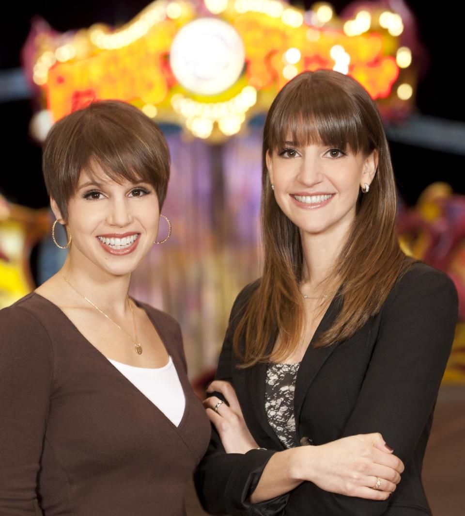 This January 2012 photo provided by Feld Entertainment shows sisters Nicole, left, and Alana Feld, producers for the Ringling Bros. and Barnum and Bailey Circus, during Ringling Bros. "Presents Dragons" show launched in Tampa, Fla. The Feld sisters are the third generation of the family to produce circus shows. Over the years, the Feld family has made changes that have alienated some traditionalists, such as eliminating the three-ring format. But the sisters say they try to walk a tightrope between innovating and maintaining traditions. (AP Photo/Feld Entertainment, Heinz Kluetmeier)