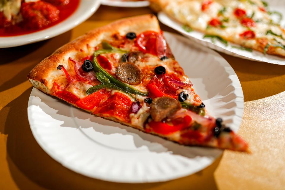 Pizza can be purchased by the slice or as a whole pie at Empire Slice House.