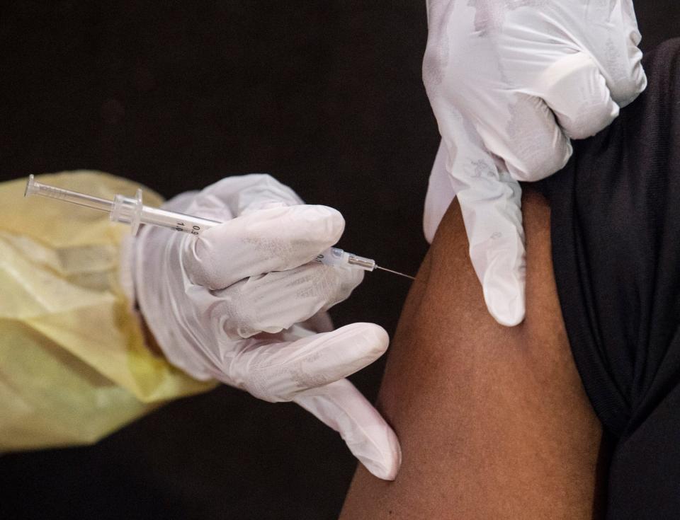 ASU Police Sgt. B. Aldridge receives the Moderna COVID-19 vaccine at the COVID-19 vaccine clinic at Alabama State University in Montgomery, Ala., on Monday, Feb. 22, 2021.