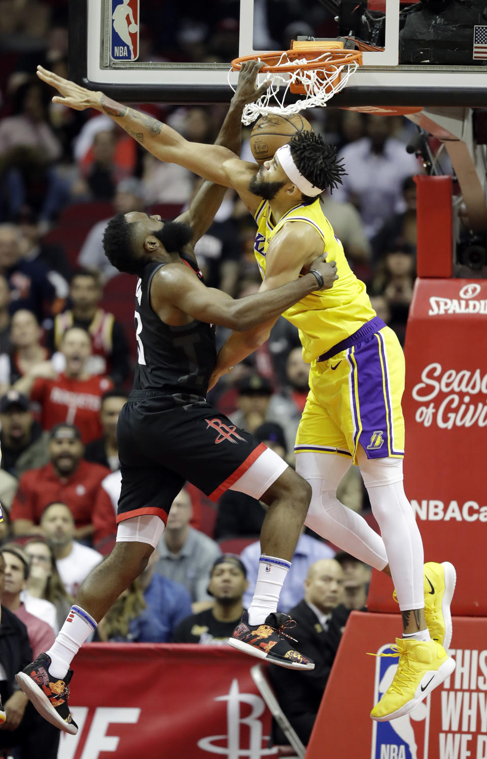 Houston Rockets' James Harden (13) dunks the ball as Los Angeles Lakers' JaVale McGee defends during the first half of an NBA basketball game Thursday, Dec. 13, 2018, in Houston. (AP Photo/David J. Phillip)