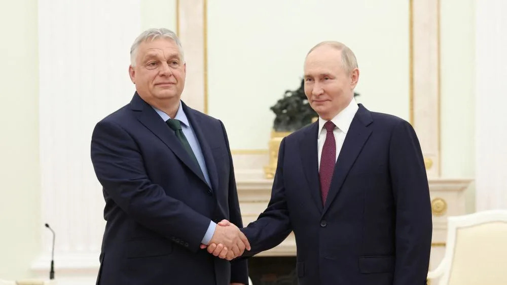 Hungarian Prime Minister Viktor Orban shaking hands with Russian President Vladimir Putin at a meeting in Moscow