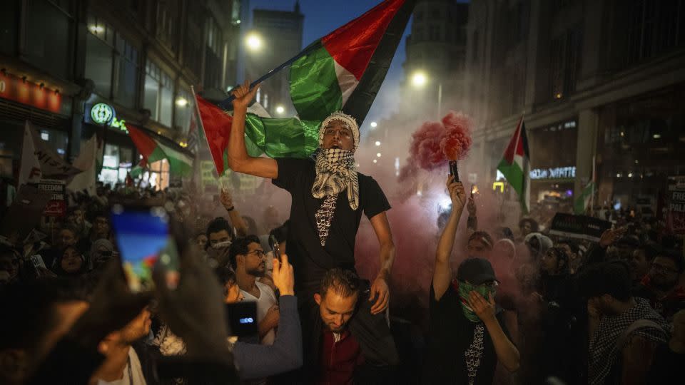 People take part in a pro-Palestinian demonstration at the Israeli Embassy in London on October 9. - Carl Court/Getty Images