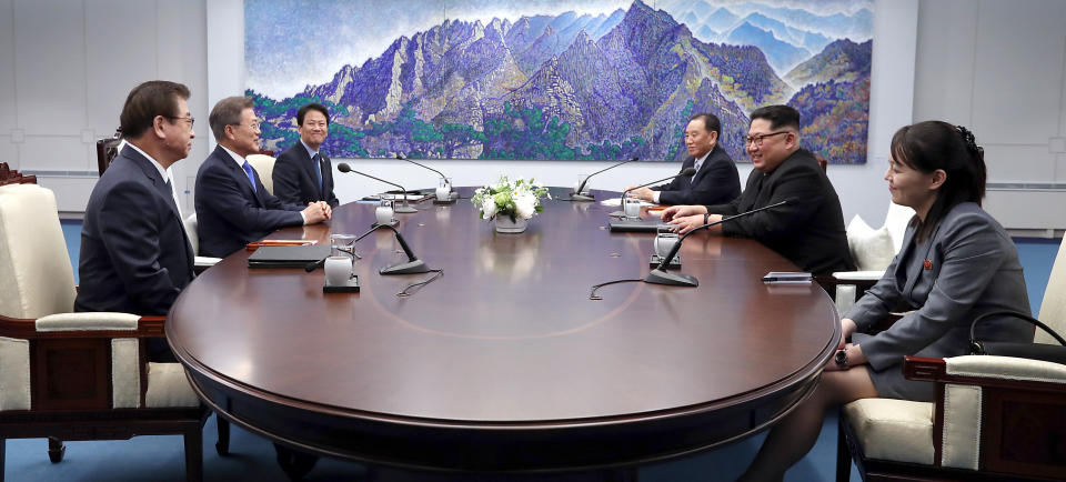 South Korean delegation including President Moon Jae-in and North Korean delegation including Leader Kim Jong Un sit down for the Inter-Korean Summit at the Peace House on April 27, 2018.