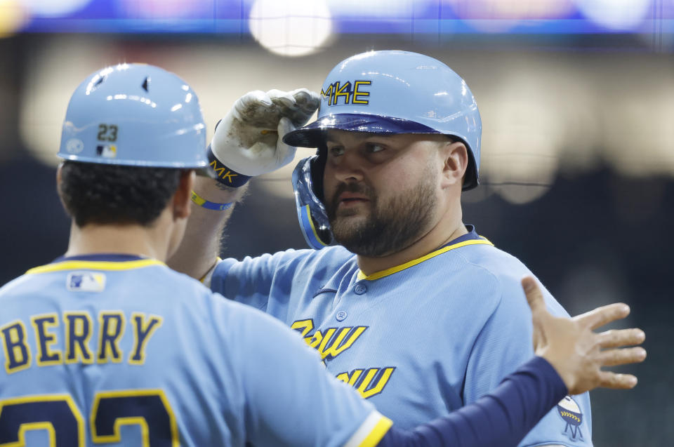 Milwaukee Brewers' Rowdy Tellez, right, reacts after hitting an RBI-single against the Los Angeles Angels during the eighth inning of a baseball game Friday, April 28, 2023, in Milwaukee. (AP Photo/Jeffrey Phelps)