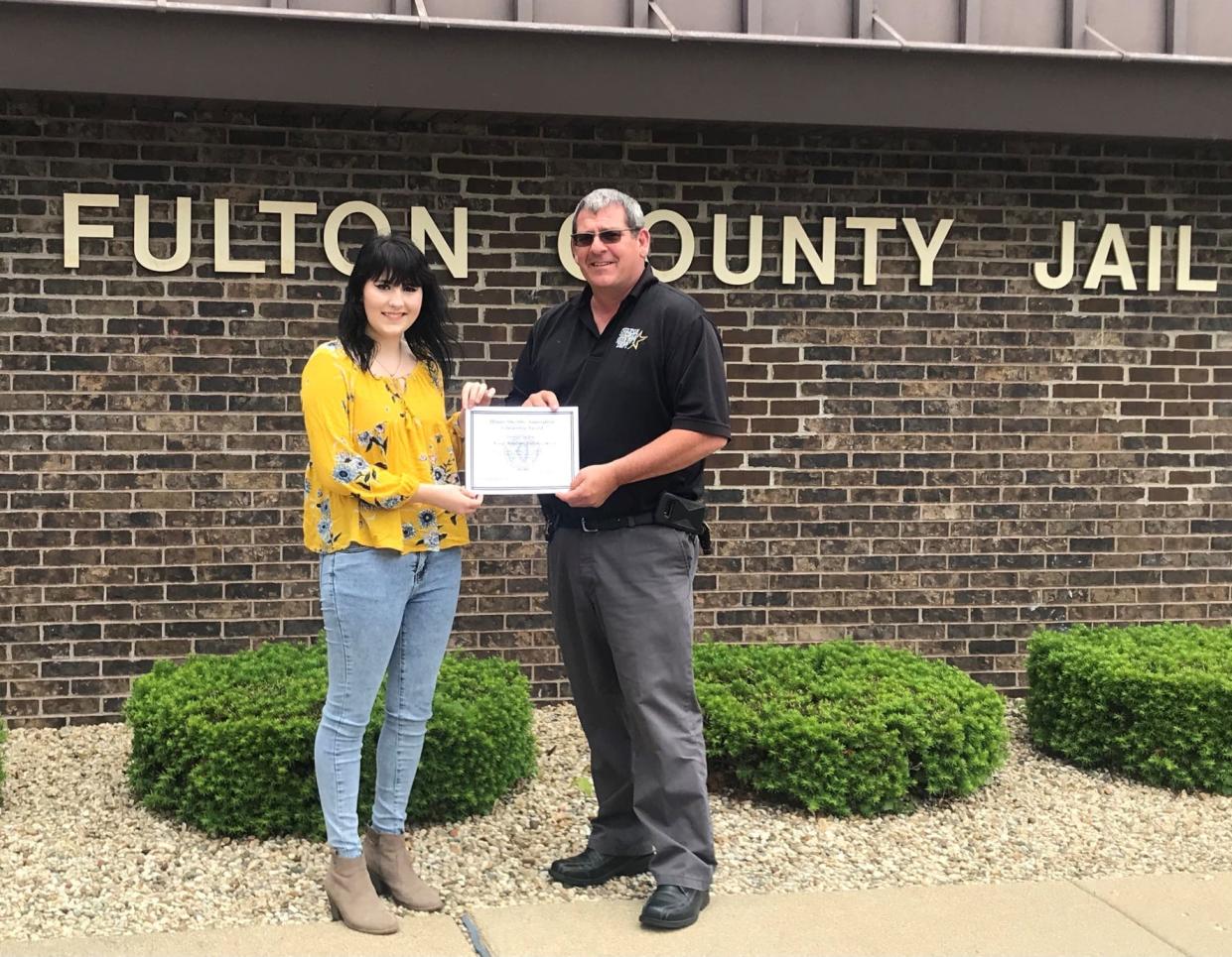 Pictured is Kaedi Windsor, Astoria, with Fulton County Sheriff Jeff Standard. Windsor was a previous recipient for the Fulton County Sheriffs’ Association Scholarship. She plans to attend Spoon River College. Applications for the 22'-23' school year are now available. (Ledger File Photo)