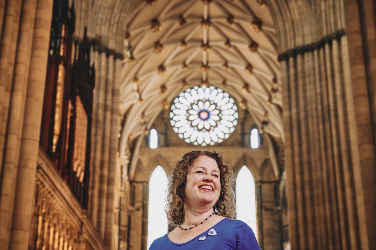 Laura Edwards below York Minster’s Rose window which inspired her boss design <i>(Image: LNER)</i>