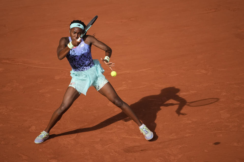 Coco Gauff of the U.S. returns the ball to Italy's Martina Trevisan during their semifinal match of the French Open tennis tournament at the Roland Garros stadium Thursday, June 2, 2022 in Paris. (AP Photo/Christophe Ena)
