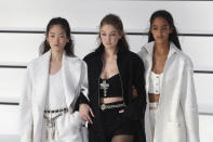 Model Gigi Hadid, center, walks with other models as they wear creations for the Chanel fashion collection during Women's fashion week Fall/Winter 2020/21 presented in Paris, Tuesday, March 3, 2020. (AP Photo/Thibault Camus)