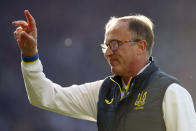 Ukraine coach Olexandr Petrakov gives instructions to his players during the warm up before the World Cup 2022 qualifying play-off soccer match between Scotland and Ukraine at Hampden Park stadium in Glasgow, Scotland, Wednesday, June 1, 2022. (AP Photo/Scott Heppell)