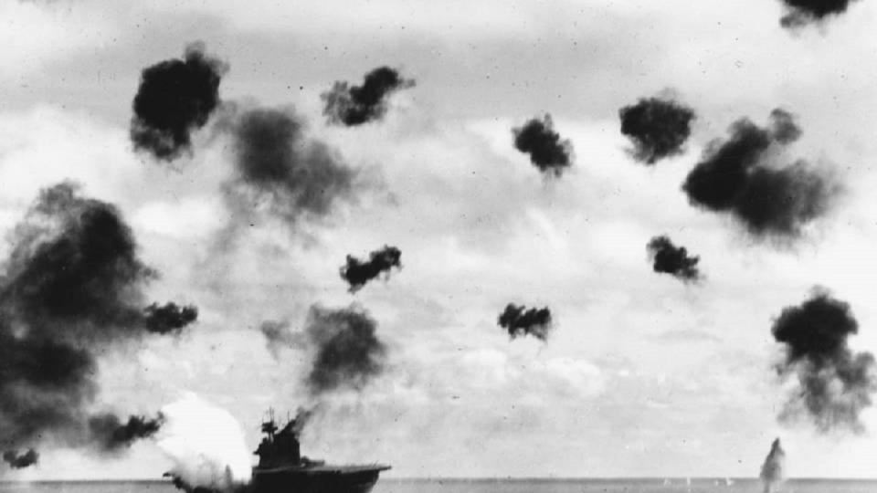The USS Yorktown is hit on the port side by a torpedo launched from a plane off the Japanese aircraft carrier Hiryu during the Battle of Midway on June 4, 1942. (National Archives and Records Administration)