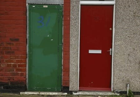 A painted red door of a house is seen on a terraced street in the Gresham area of Middlesbrough, northern Britain, January 20, 2016. REUTERS/Phil Noble