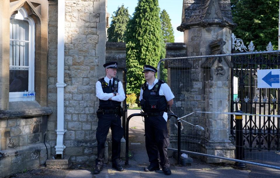Police officers outside Lavender Hill Cemetery in Enfield, north London (Yui Mok/PA Wire)