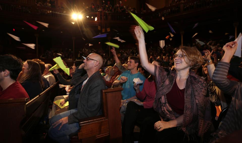 Audience members throw paper airplanes during a performance at the Ig Nobel Prize ceremony at Harvard University, in Cambridge, Mass., Thursday, Sept. 20, 2012. The Ig Nobel prize is an award handed out by the Annals of Improbable Research magazine for silly sounding scientific discoveries that often have surprisingly practical applications. (AP Photo/Charles Krupa)