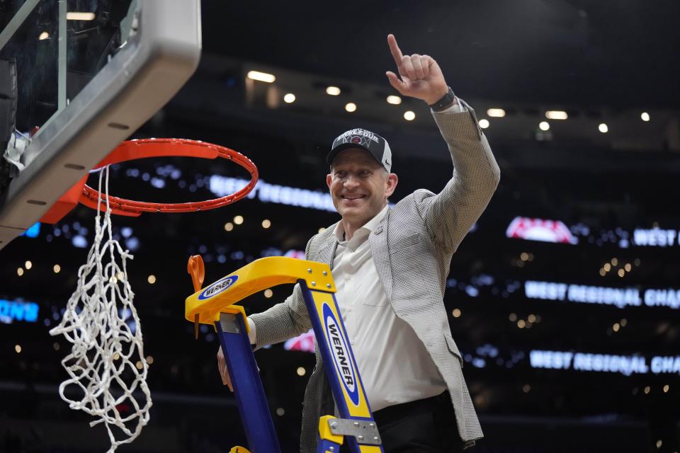 Alabama Crimson Tide head coach Nate Oats cuts the net after defeating the Clemson Tigers in the finals of the West Regional of the 2024 NCAA Tournament at Crypto.com Arena in Los Angeles on March 30, 2024.