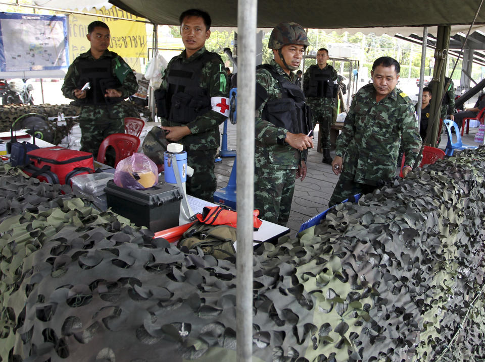 Thai soldiers take up duty at a bunker near the protest site of Lumpini park in Bangkok, Thailand Tuesday, March 18, 2014. Thailand’s government is lifting a state of emergency in Bangkok and surrounding areas after violence related to the country’s political crisis eased. (AP Photo/Apichart Weerawong)