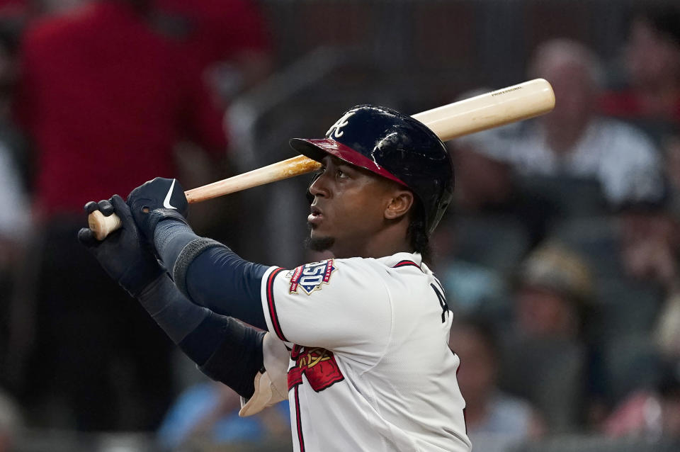 Atlanta Braves' Ozzie Albies watches his three-run home run during the fifth inning of the team's baseball game against the New York Mets on Tuesday, June 29, 2021 in Atlanta. (AP Photo/John Bazemore)