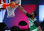 Boston Celtics' Jaylen Brown dunks against the Portland Trail Blazers during an NBA basketball game Sunday, Aug. 2, 2020, in Lake Buena Vista, Fla. (Mike Ehrmann/Pool Photo via AP)