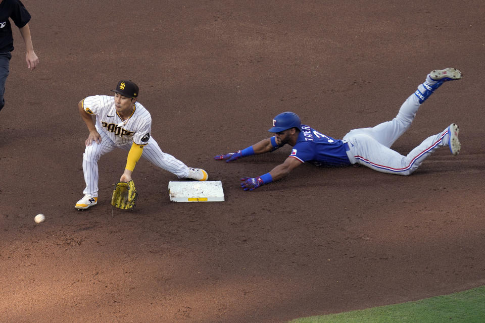 Texas Rangers' Leody Taveras, right, slides into second base for a double as San Diego Padres second baseman Ha-Seong Kim waits for the throw during the second inning of a baseball game Saturday, July 29, 2023, in San Diego. (AP Photo/Gregory Bull)