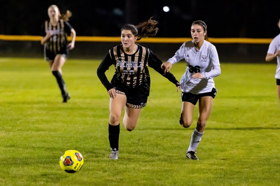 Buchholz Bobcats forward Zoe Torres (20) dribbles the ball during the second half against the Niceville Eagles during the 2022 6A FHSAA Girls Soccer State Championship Tournament at Citizens Field in Gainesville, FL on Tuesday, February 8, 2022. [Matt Pendleton/Gainesville Sun]