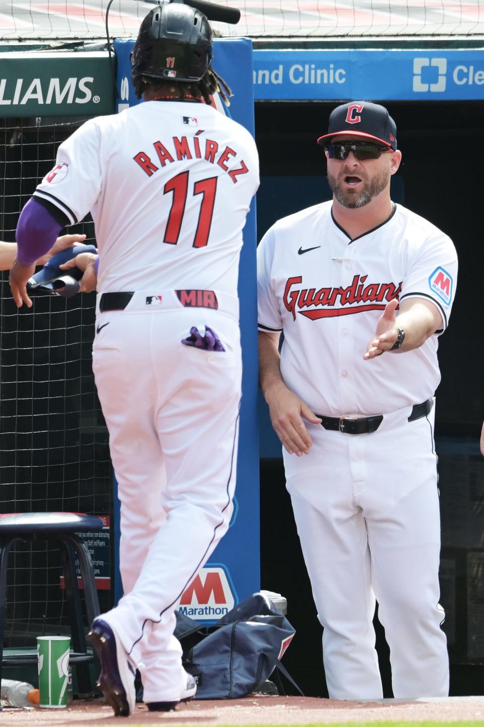 Cleveland Guardians manager Stephen Vogt, right, celebrates with Jose Ramirez (11) after Ramirez scored in the first inning against the Washington Nationals on Tuesday in Cleveland.