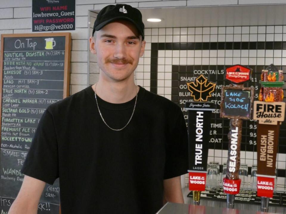 Lake of the Woods Brewery bartender Erik McCarthy says revenue was three times the normal amount for a typical Jets game on Saturday, thanks to the thousands of fans flocking downtown.  (Jeff Stapleton/CBC - image credit)