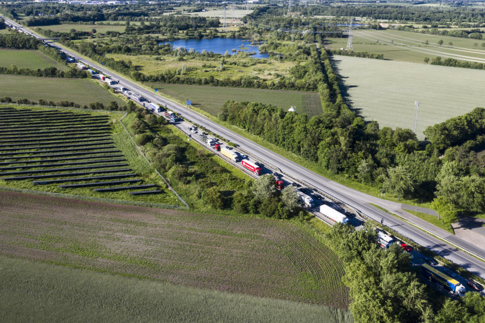 Cars and trucks queue on highway E45 after Denmark reopened its borders to Germany Monday, June 15, 2020, following the new coronavirus pandemic. (Claus Fisker/Ritzau Scanpix via AP)