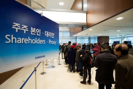 Shareholders queue in line to enter the Samsung Electronics Co. annual general meeting at the company's Seocho office building in Seoul, South Korea, March 23, 2018. SeongJoon Cho/Pool via Reuters