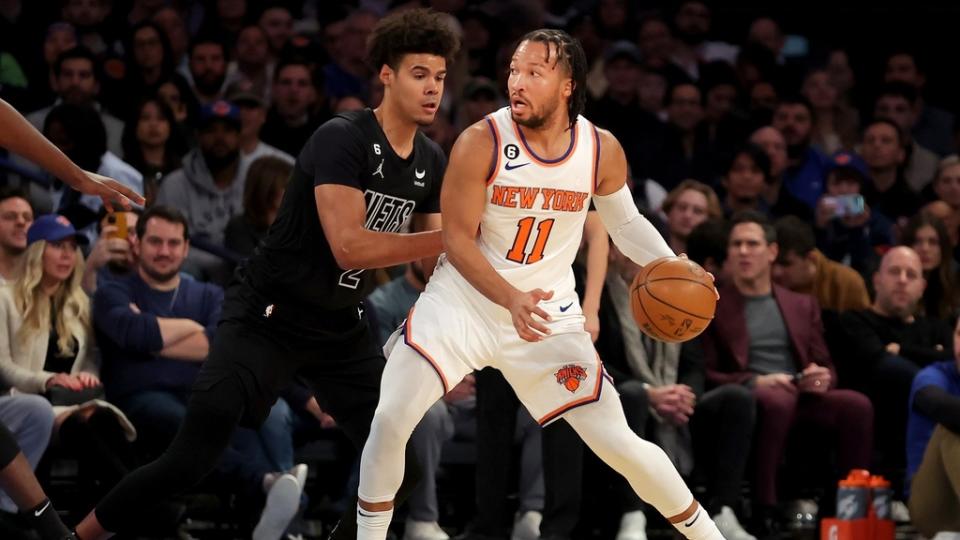 Feb 13, 2023; New York, New York, USA; New York Knicks guard Jalen Brunson (11) controls the ball against Brooklyn Nets forward Cameron Johnson (2) during the first quarter at Madison Square Garden.