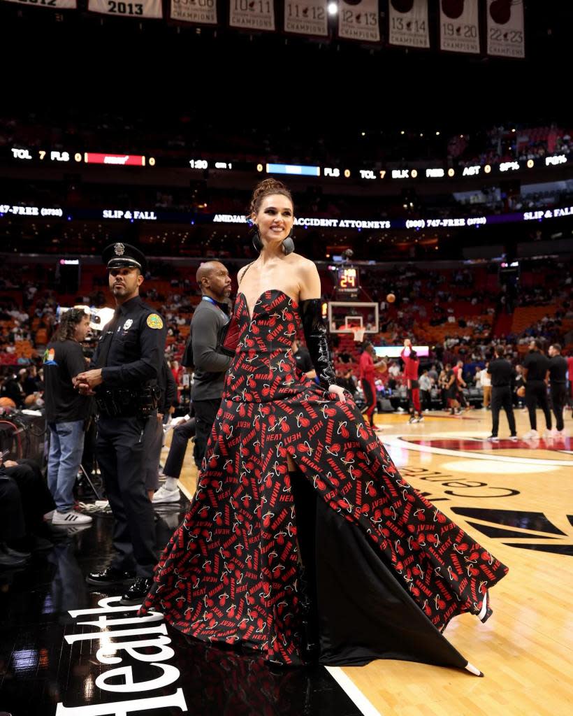 Lolly creates her custom basketball gowns out of fabric with the Miami Heat logo. radmilalolly/Instagram