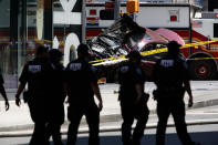 <p>Flames and smoke rises from a wrecked vehicle after it plowed into pedestrians on a busy sidewalk on the corner of West 45th St. and Broadway at Times Square, New York, NY United States on May 18, 2017. Multiple pedestrians were struck Thursday by a speeding vehicle in the heart of New York City, according to reports. (Photo: Volkan Furuncu/Anadolu Agency/Getty Images) </p>