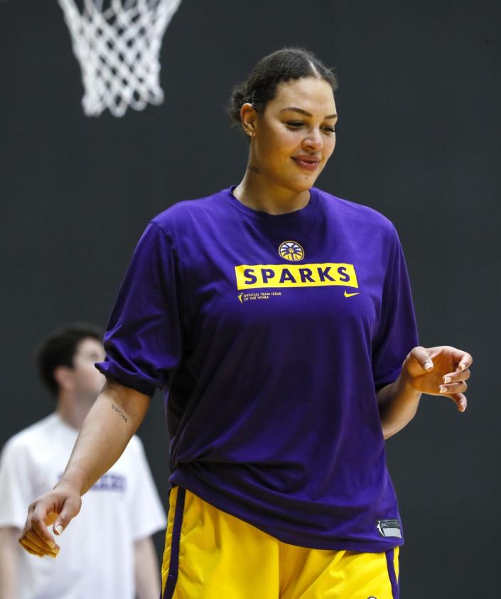 Liz Cambage takes a break between drills during a Sparks practice.