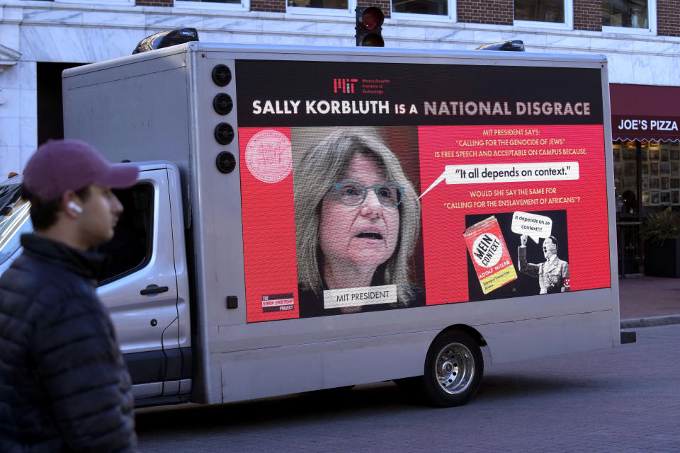 A truck with electronic panels drives along a street Tuesday, Dec. 12, 2023, near Harvard University, in Cambridge, Mass., while displaying messages calling attention to a recent controversy involving testimony to Congress by presidents of three prestigious schools, including Harvard University, MIT, and the University of Pennsylvania. Harvard President Claudine Gay will remain leader of Harvard following her comments last week at a congressional hearing on antisemitism, the university's highest governing body announced Tuesday. (AP Photo/Steven Senne)