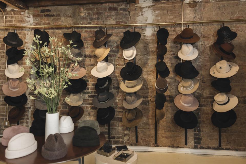 A photo of inside the Gigi Burris store of her many hats.