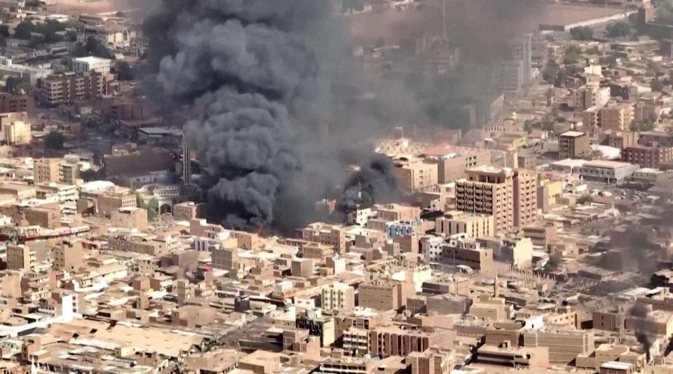 FILE PHOTO: A file photos shows an aerial view of the black smoke and flames at a market in Omdurman, Khartoum North, Sudan, May 17, 2023, in this screengrab obtained from a handout video. (Video Obtained By Reuters)