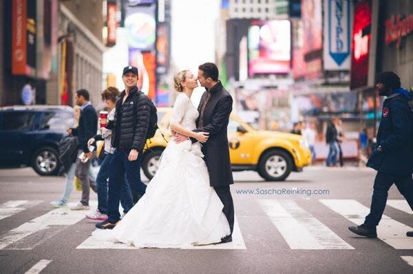 "The funny thing about this was that I didn’t even notice it until I started to edit the images earlier tonight! I scanned through the set and his face looked familiar. 'Is that Zach Braff?'" - <a href="http://love.saschareinking.com/new-york-city-elopement-photobomb-zach-braff-celebrity-cameo/" target="_blank">Photographer Sascha Reinking </a>  [Credit: <a href="http://love.saschareinking.com/" target="_hplink">Sascha Reinking Photography</a>] 