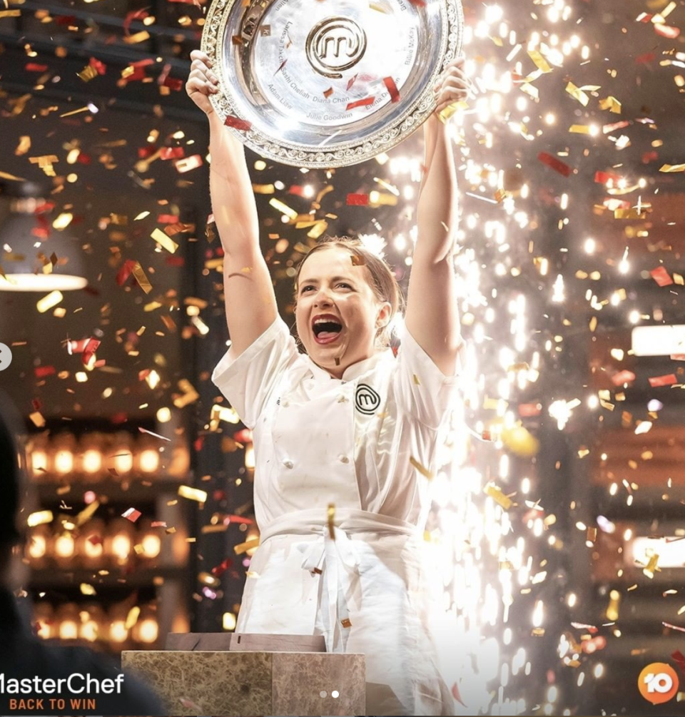 Emilia Jackson lifting up the MasterChef trophy