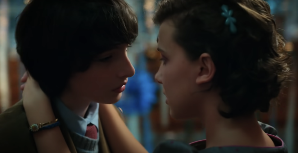 Finn Wolfhard and Millie Bobby Brown during a kissing scene on Stranger Things. 