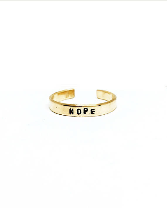 Get it <a href="https://www.etsy.com/listing/489824024/nope-handstamped-stackable-ring-mantra?ga_order=most_relevant&amp;ga_search_type=all&amp;ga_view_type=gallery&amp;ga_search_query=nope%20ring&amp;ref=sr_gallery-1-2" target="_blank">here</a>.&nbsp;