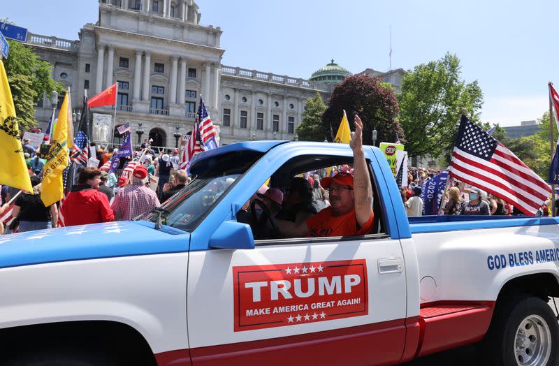 Trump supporters and others rally against coronavirus disease restrictions at the Pennsylvania Capitol in Harrisburg