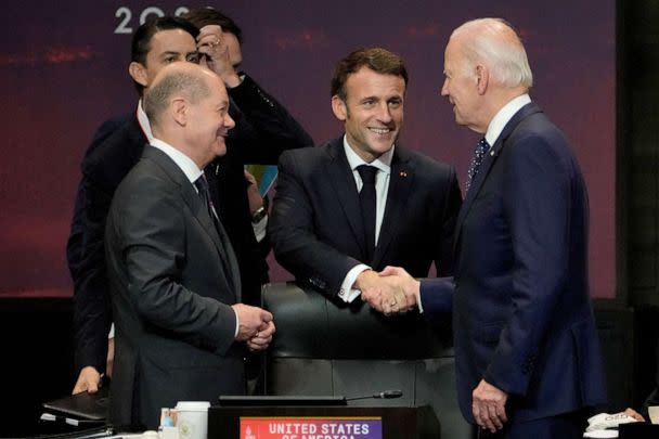 PHOTO: President Joe Biden shakes hands with French President Emmanuel Macron as German Chancellor Olaf Scholz looks on during the G20 leaders' summit in Nusa Dua, Bali, Indonesia, Nov. 15, 2022. (Dita Alangkara/Reuters)