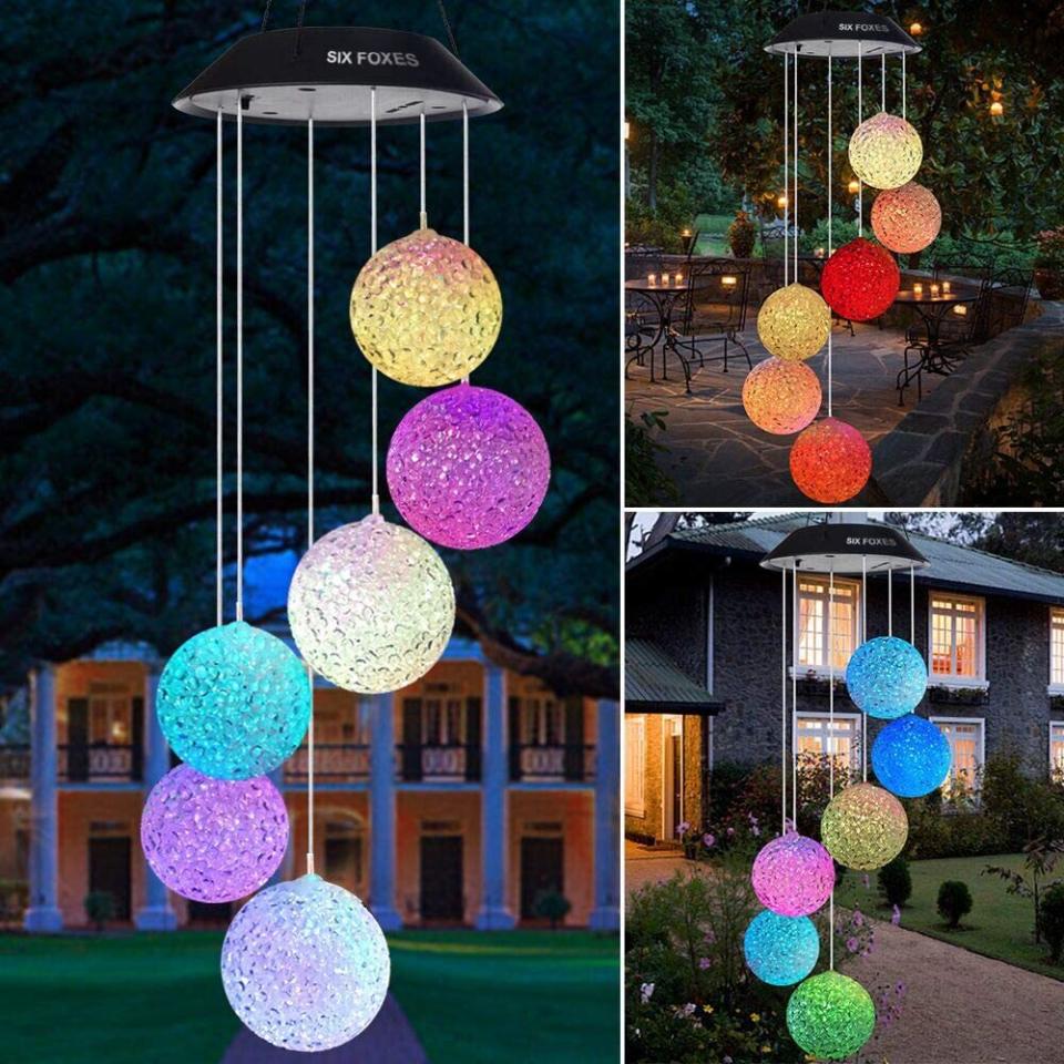 Your porch will look like a colorful disco when it's nighttime. <br /><br /><strong>Promising review:</strong> "When I first took this out of the box, I thought 'oh boy I don&rsquo;t know about this,' but I went ahead and hung it up outside to charge. <strong>When nighttime came, it started to light up and it is so neat. The colors gently change and none of them are muted.</strong> I am so happy with it." &mdash; <a href="https://amzn.to/3epY0xh" target="_blank" rel="nofollow noopener noreferrer" data-skimlinks-tracking="5580838" data-vars-affiliate="Amazon" data-vars-href="https://www.amazon.com/gp/customer-reviews/R3NP0N6W10Q2PY?tag=bfgenevieve-20&amp;ascsubtag=5580838%2C30%2C33%2Cmobile_web%2C0%2C0%2C1159962" data-vars-keywords="cleaning,fast fashion" data-vars-link-id="1159962" data-vars-price="" data-vars-product-id="16176946" data-vars-retailers="Amazon">Amazon Customer</a><br /><br /><strong>Get it from Amazon for <a href="https://amzn.to/32BBA6O" target="_blank" rel="nofollow noopener noreferrer" data-skimlinks-tracking="5580838" data-vars-affiliate="Amazon" data-vars-asin="B07P2JXD73" data-vars-href="https://www.amazon.com/dp/B07P2JXD73?tag=bfgenevieve-20&amp;ascsubtag=5580838%2C30%2C33%2Cmobile_web%2C0%2C0%2C1159944" data-vars-keywords="cleaning,fast fashion" data-vars-link-id="1159944" data-vars-price="" data-vars-product-id="7796634" data-vars-product-img="https://m.media-amazon.com/images/I/61G+HI-O+LL._SL500_.jpg" data-vars-product-title="YARD DECOR LIGHTED WIND CHIME" data-vars-retailers="Amazon">$21.99</a>.</strong>