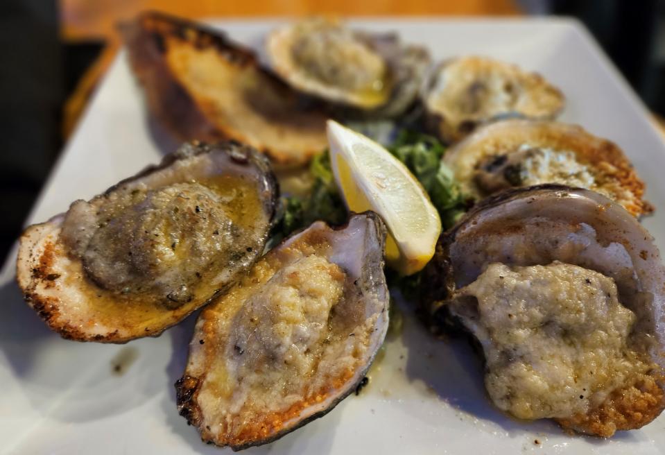 Chargrilled oysters at St. Armands Oyster Bar in Sarasota photographed July 8, 2023. The restaurant permanently closed in August, 2023.