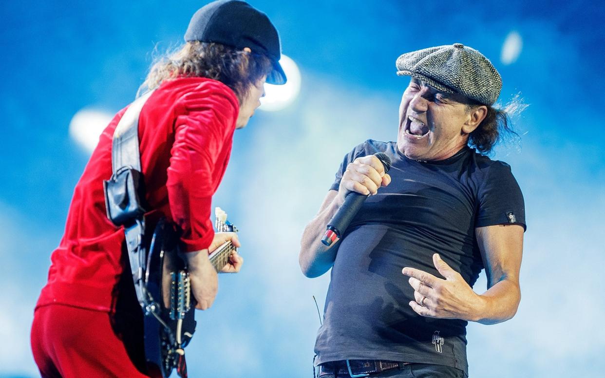 Down but not out: Angus Young (l) and Brian Johnson (r) performing in 2015 - Daniel Pockett