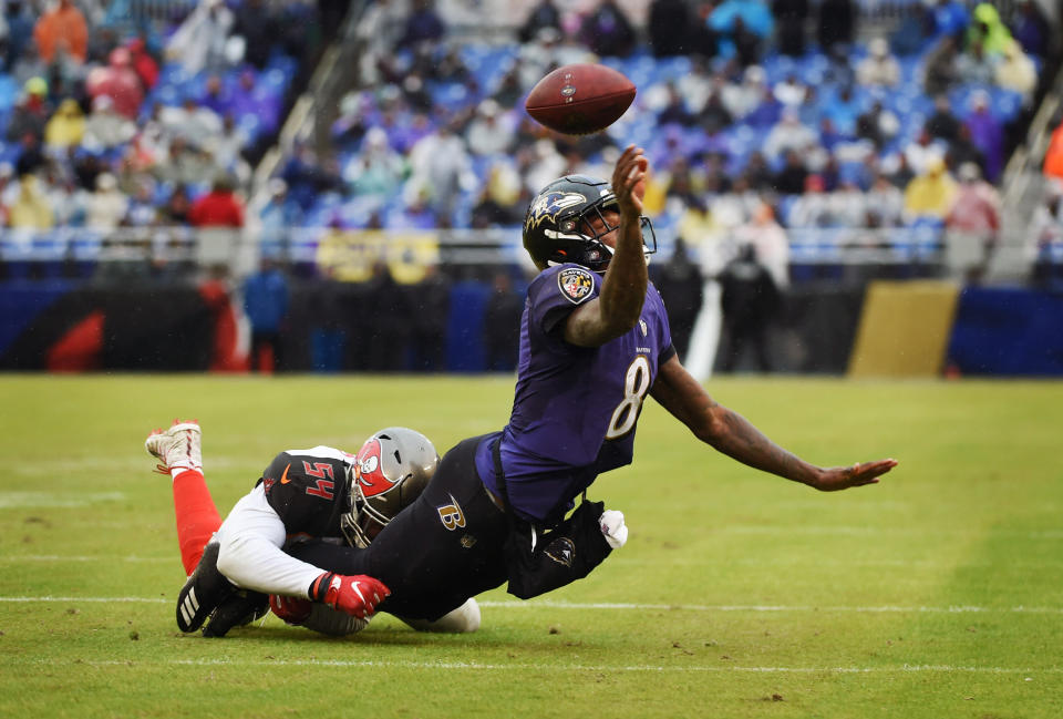 <p>Baltimore Ravens quarterback Lamar Jackson throws the ball away to avoid a sack by Tampa Bay Buccaneers’ Lavonte Davis in the second quarter on Sunday, Dec. 16, 2018 at M&T Bank Stadium in Baltimore, Md. The Ravens defeated the Buccaneers, 20-12. (Kenneth K. Lam/Baltimore Sun/TNS) </p>