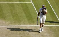 Argentina's Juan Martin Del Potro wipes his face in his match against Serbia's Novak Djokovic during day eleven of the Wimbledon Championships at The All England Lawn Tennis and Croquet Club, Wimbledon.