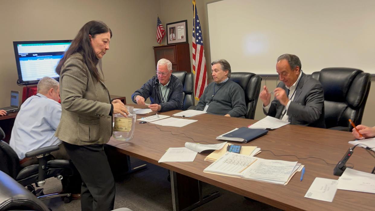 Stark County Board of Elections Deputy Director Regine Johnson Tuesday prepares a pickle jar for the random selection of a polling location for the Perry Township police levy recount. The levy passed by 10 votes after the final vote count.