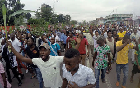 Demonstrators chant slogans during a protest against President Joseph Kabila, organized by the Catholic church in Kinshasa, Democratic Republic of Congo January 21, 2018. REUTERS/Kenny Katombe