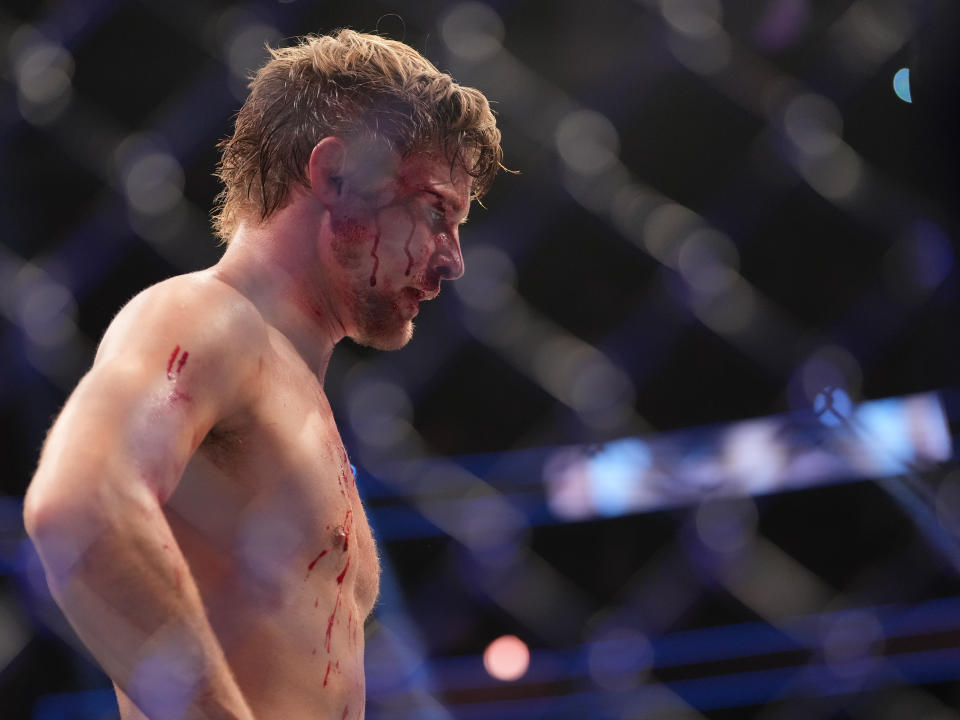 Dec 10, 2022; Las Vegas, Nevada, USA; Bryce Mitchell (red gloves) reacts after the fight against Ilia Topuria (blue gloves) during UFC 282 at T-Mobile Arena. Mandatory Credit: Stephen R. Sylvanie-USA TODAY Sports